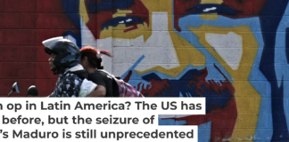 A motorcycle rides past graffiti depicting Venezuelan President Nicolas Maduro in Caracas on Jan. 3, 2026. Juan Barreto/AFP via Getty Images